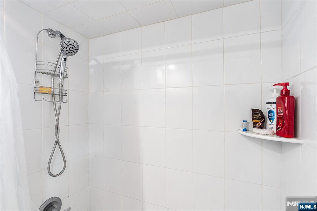128 Baltimore Avenue Hillside, NJ 07205 - Photo 25 of 50 a bathroom with a shower