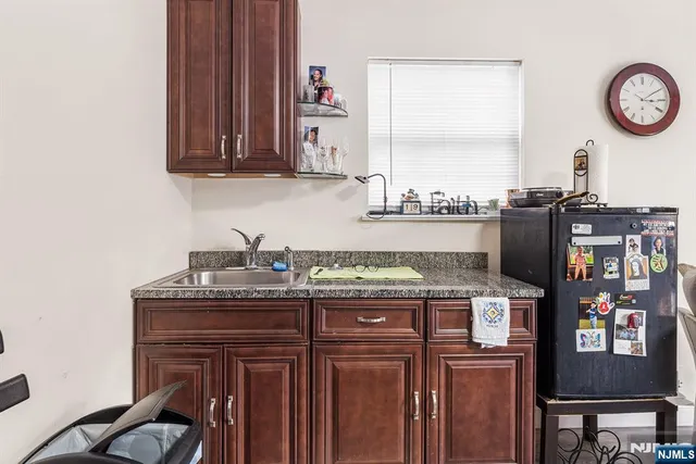 a kitchen with stainless steel appliances granite countertop a stove and a microwave