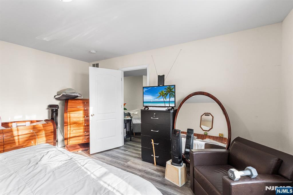 128 Baltimore Avenue Hillside, NJ 07205 - Photo 33 of 50 a bedroom with bed and a large window