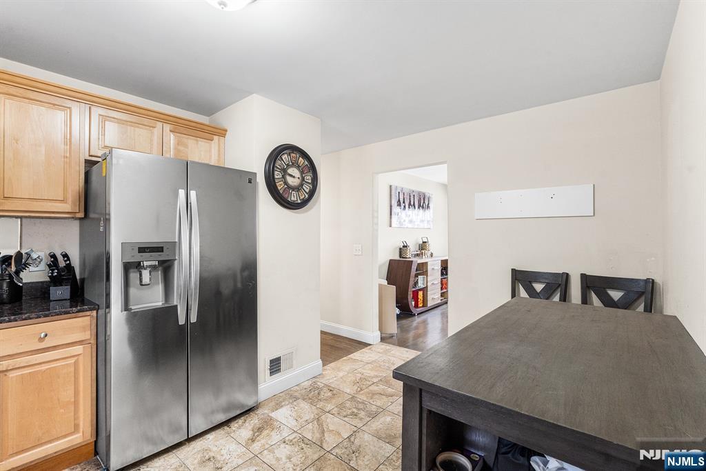 128 Baltimore Avenue Hillside, NJ 07205 - Photo 35 of 50 a kitchen with stainless steel appliances granite countertop a refrigerator a stove and a sink with large window
