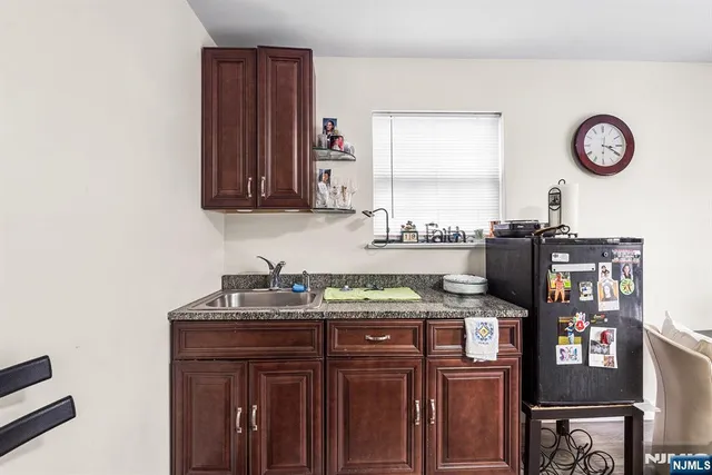 a living room with furniture or wooden floor and a rug