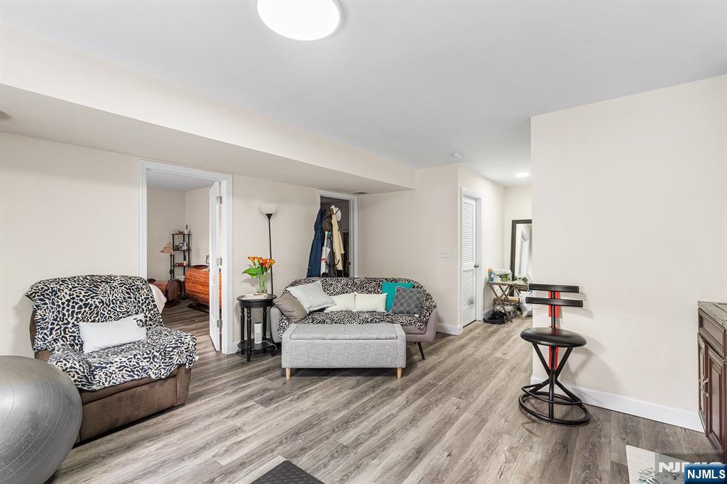 128 Baltimore Avenue Hillside, NJ 07205 - Photo 38 of 50 a living room with furniture or wooden floor and a rug