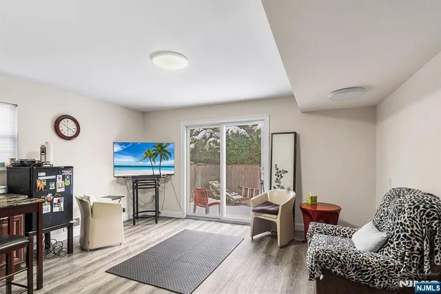 a living room with furniture and a rug