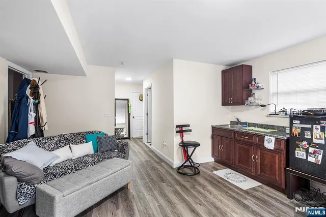 a kitchen with stainless steel appliances granite countertop a stove sink and cabinets