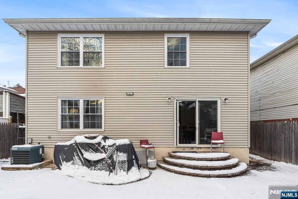 128 Baltimore Avenue Hillside, NJ 07205 - Photo 47 of 50 a white house with table and chairs