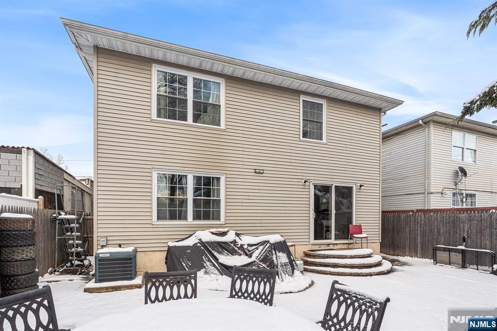 128 Baltimore Avenue Hillside, NJ 07205 - Photo 48 of 50 a front view of a house with outdoor seating