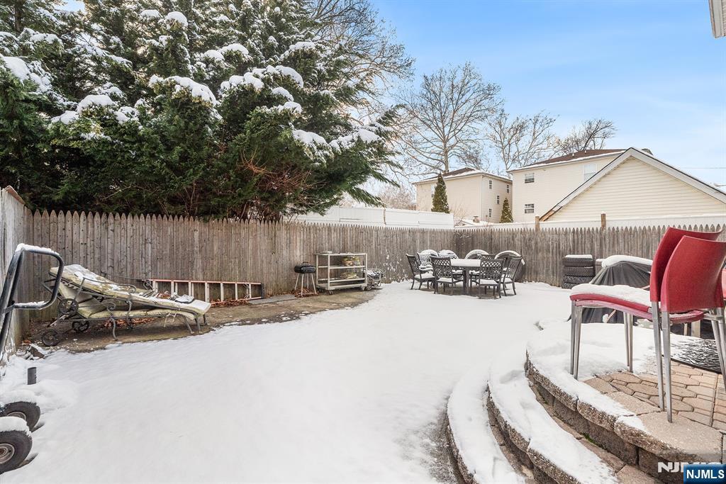 128 Baltimore Avenue Hillside, NJ 07205 - Photo 50 of 50 a view of a backyard with a fire pit and chairs