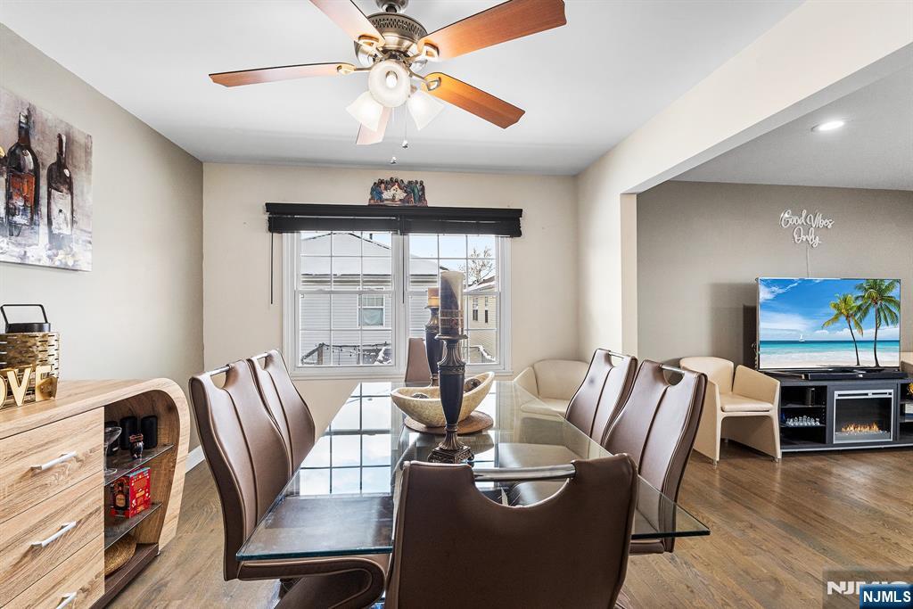 128 Baltimore Avenue Hillside, NJ 07205 - Photo 10 of 50 a view of a dining room with furniture wooden floor and chandelier