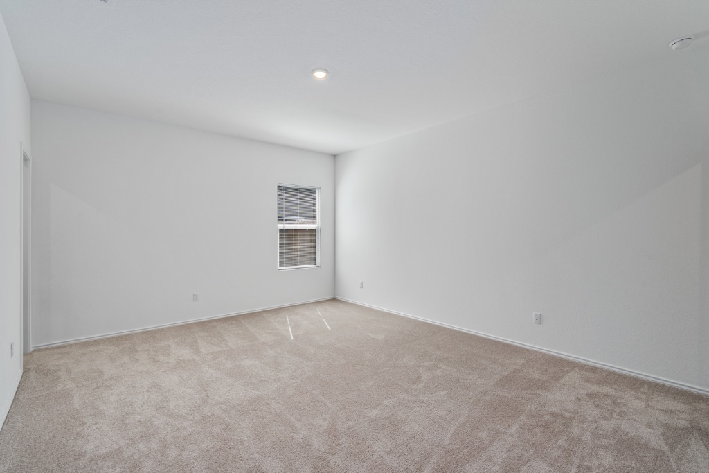 230 Gabbro Gardens Maxwell, TX 78656 - Photo 10 of 24 a view of an empty room with a window