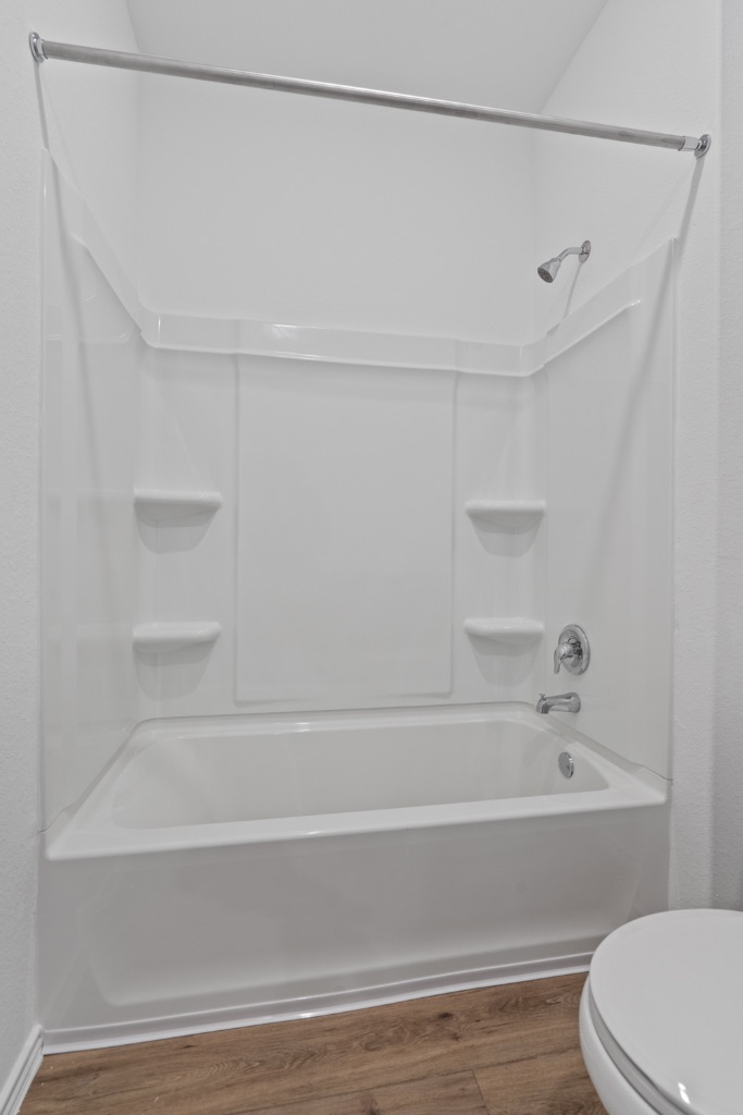 230 Gabbro Gardens Maxwell, TX 78656 - Photo 19 of 24 a bathroom with a shower and a toilet