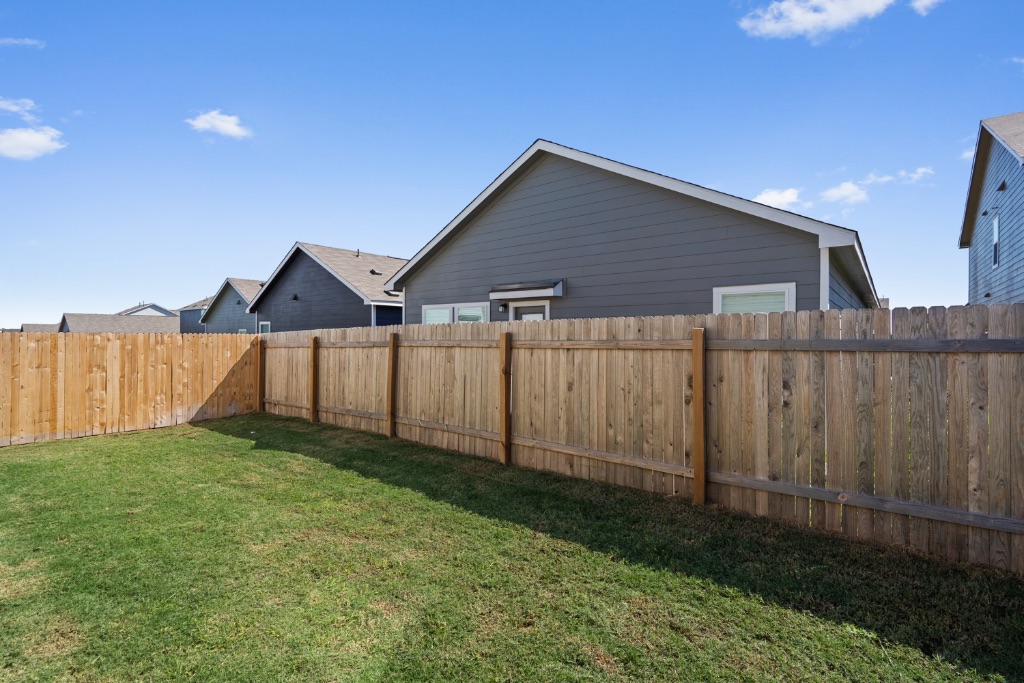230 Gabbro Gardens Maxwell, TX 78656 - Photo 21 of 24 a backyard of a house with wooden fence