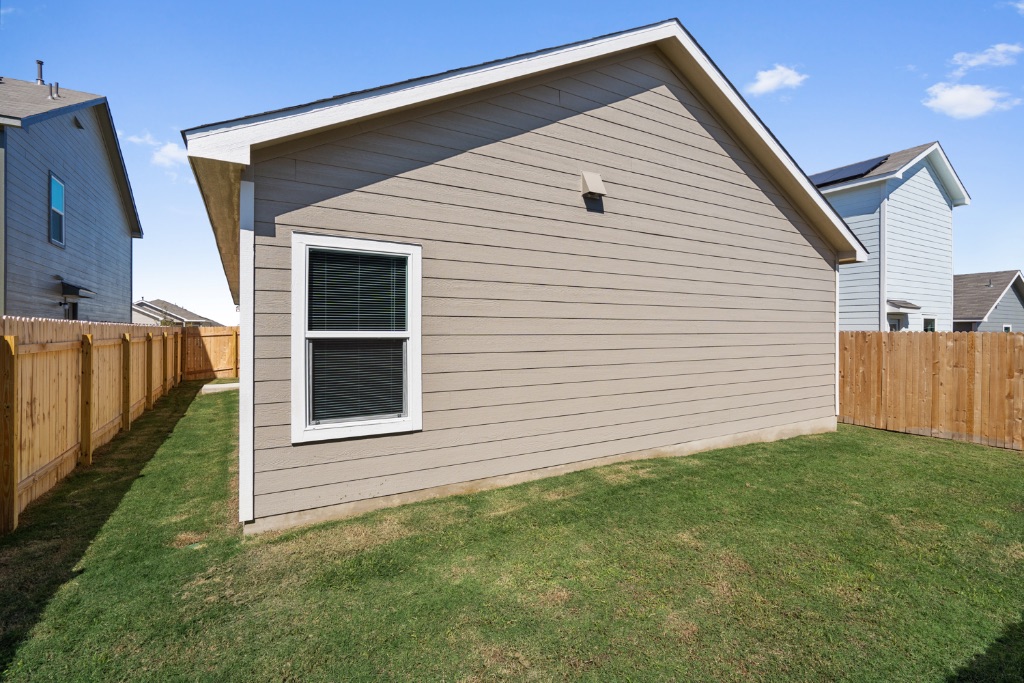 230 Gabbro Gardens Maxwell, TX 78656 - Photo 22 of 24 a view of a backyard with wooden fence