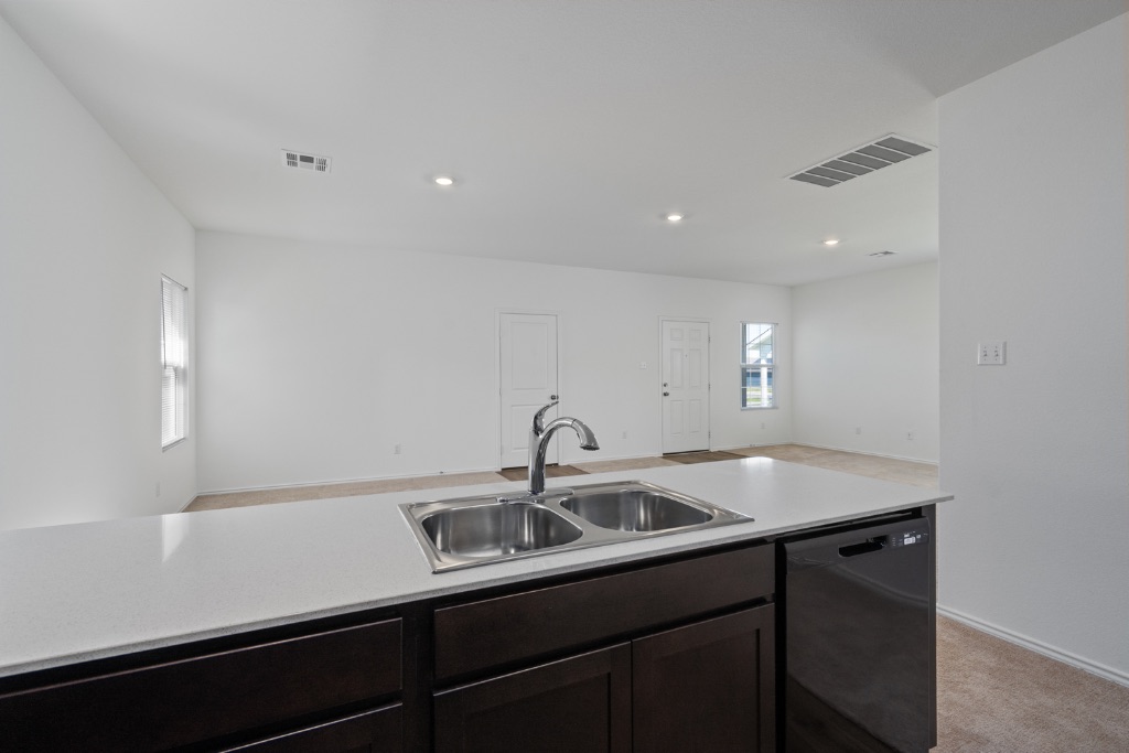 230 Gabbro Gardens Maxwell, TX 78656 - Photo 24 of 24 a kitchen with a sink and cabinets