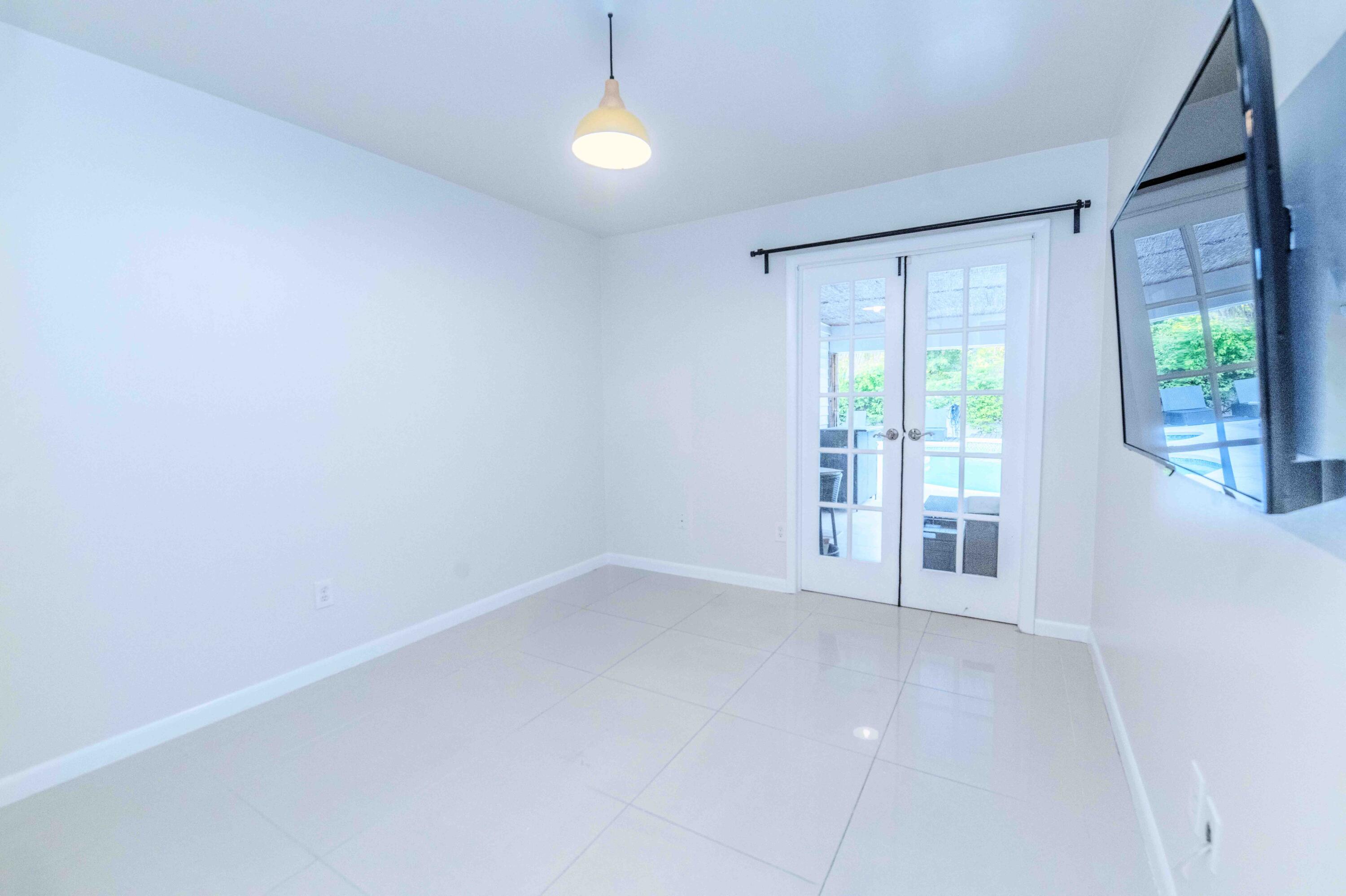 8111 Cedar Hollow Lane Boca Raton, FL 33433 - Photo 16 of 26 a view of an empty room with a window