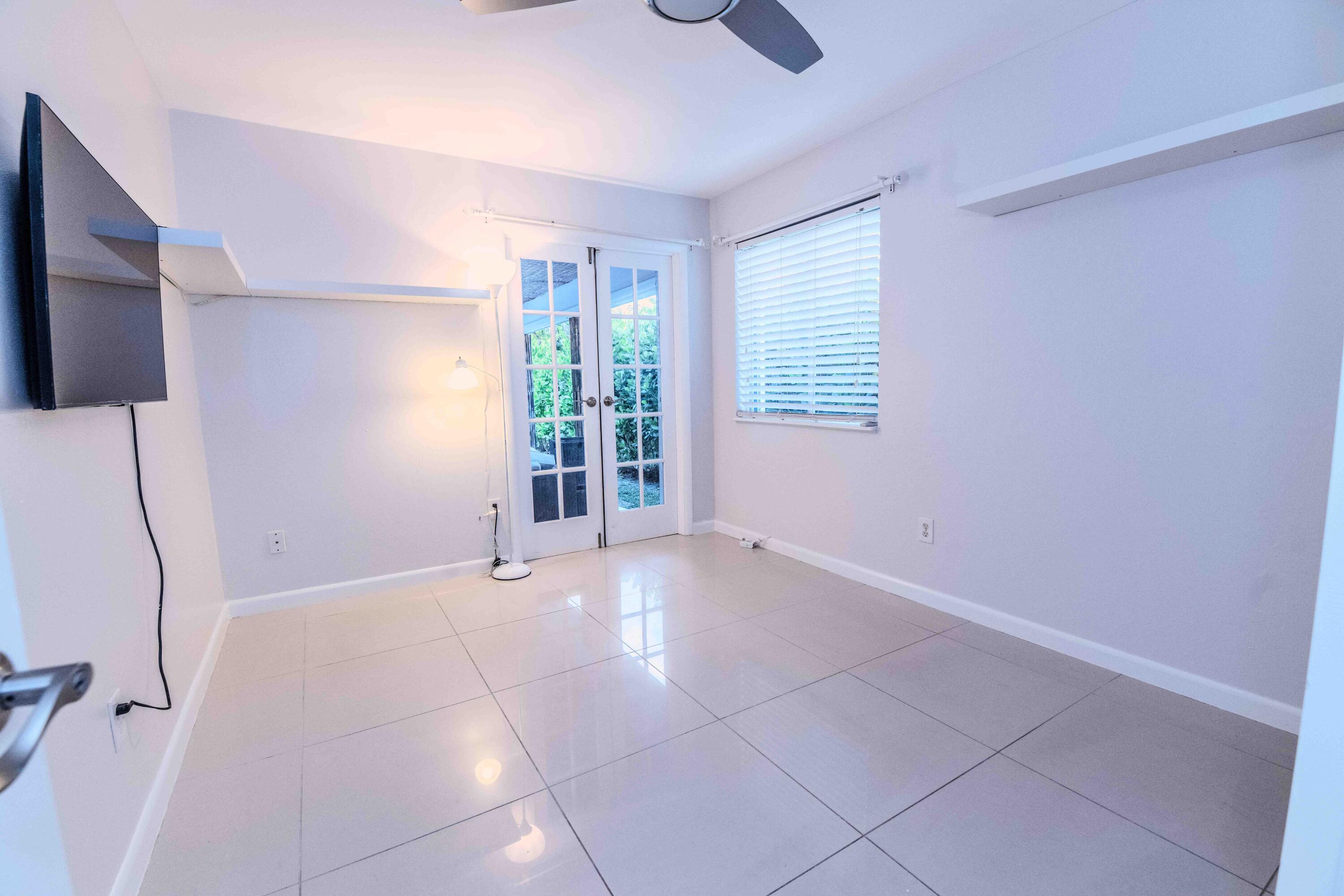 8111 Cedar Hollow Lane Boca Raton, FL 33433 - Photo 17 of 26 a view of an empty room with a window