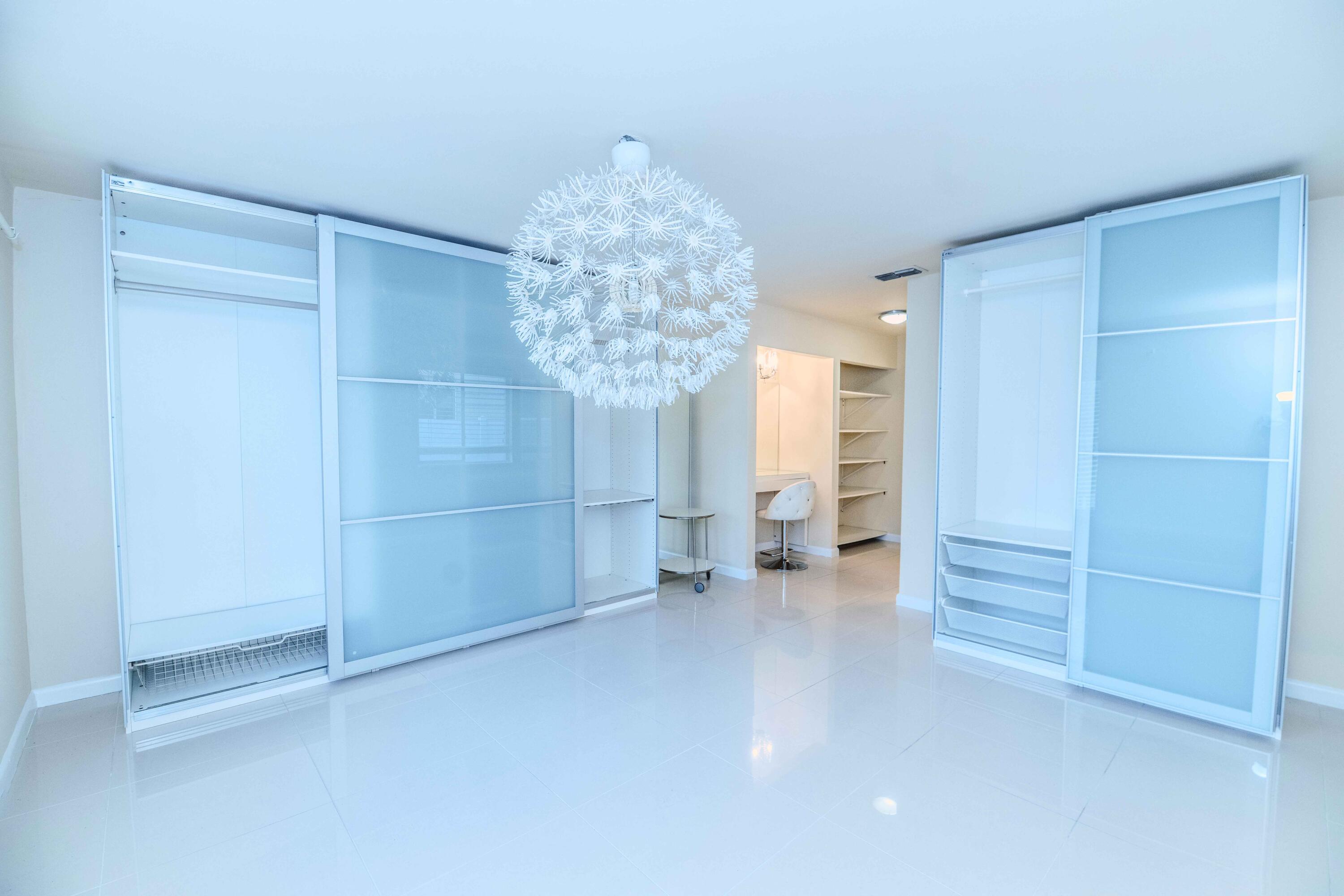 8111 Cedar Hollow Lane Boca Raton, FL 33433 - Photo 21 of 26 a view of an empty room with a cabinet