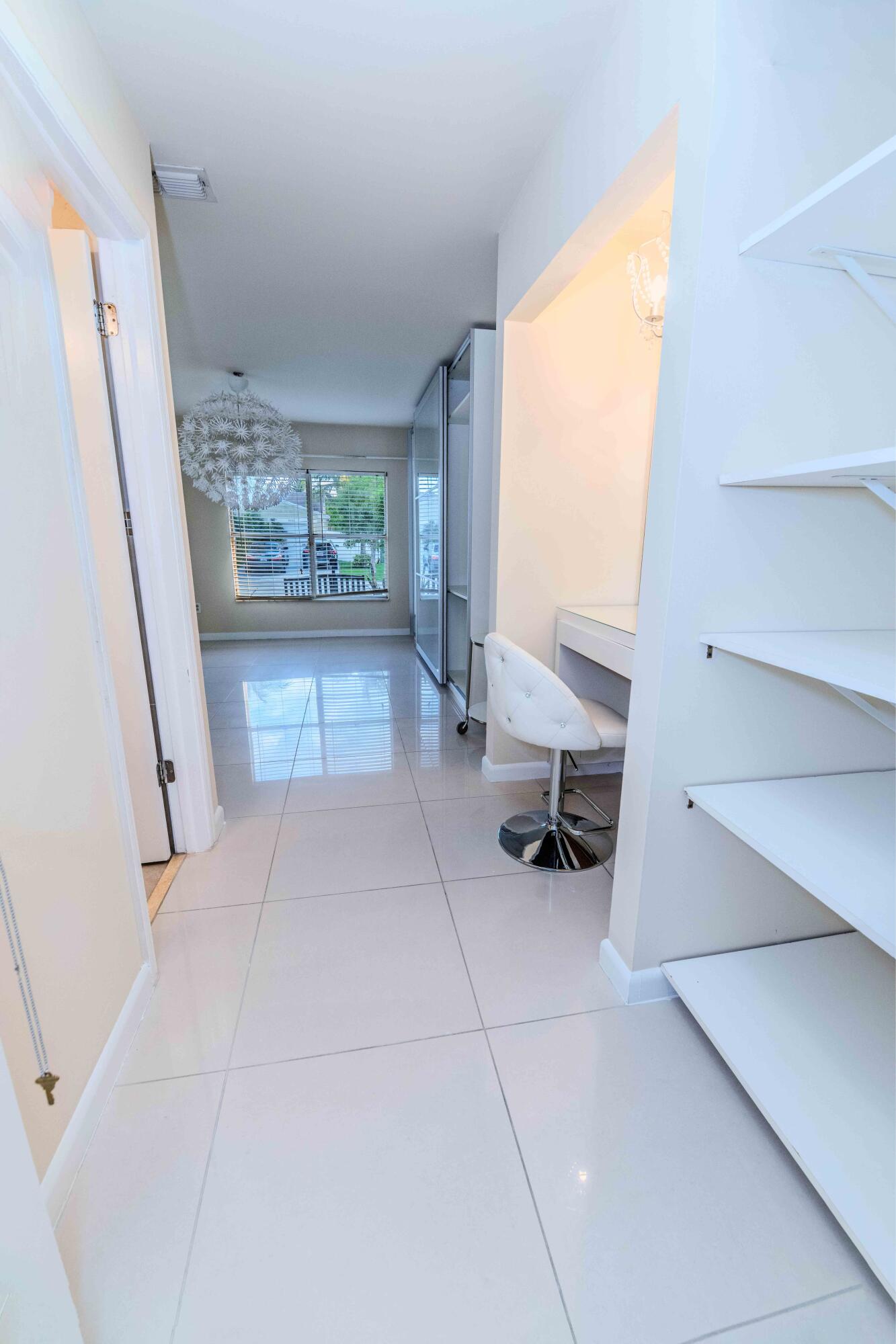 8111 Cedar Hollow Lane Boca Raton, FL 33433 - Photo 22 of 26 a living room with furniture and a fireplace