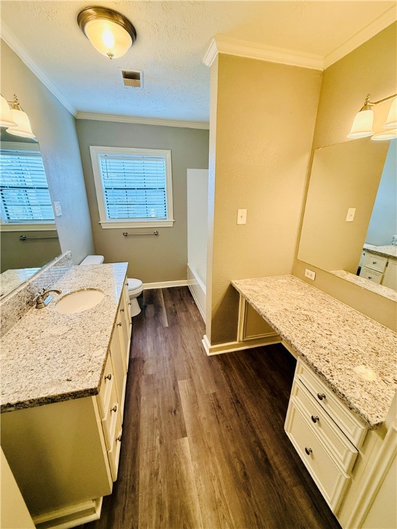 1413 Burt Street Bryan, TX 77802 - Photo 12 of 19 a view of a kitchen with wooden floor and a sink