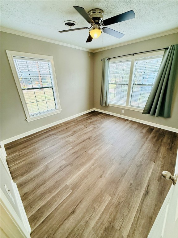 1413 Burt Street Bryan, TX 77802 - Photo 14 of 19 wooden floor in an empty room with a window