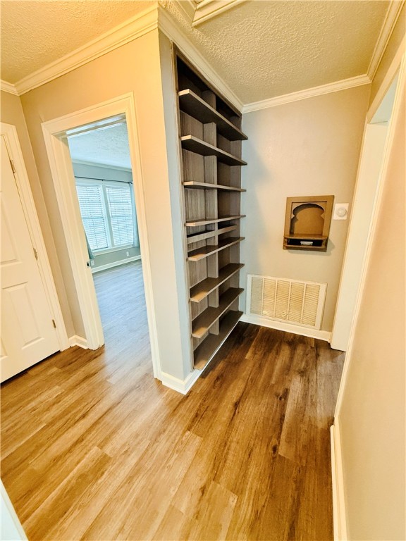 1413 Burt Street Bryan, TX 77802 - Photo 15 of 19 a view of walk in closet with empty racks