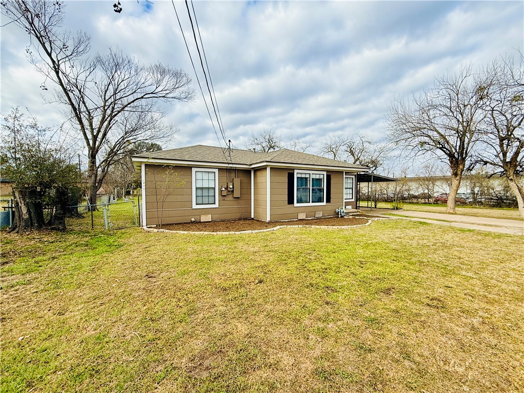 1413 Burt Street Bryan, TX 77802 - Photo 3 of 19 a front view of a house with a garden