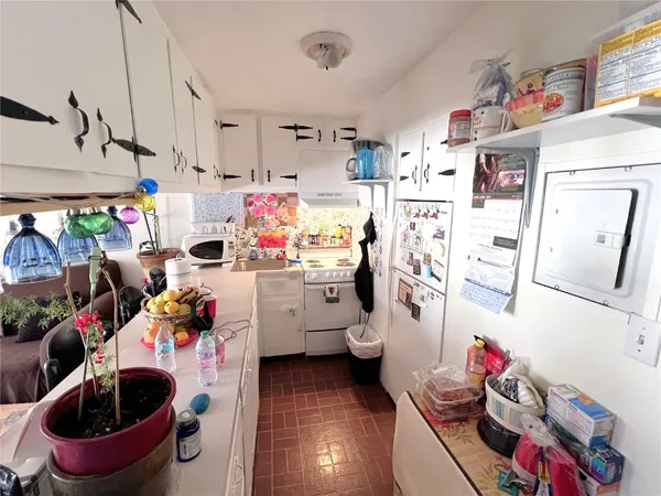 a storage utility room with a lot of stuff and washer