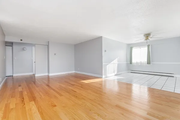 a view of an empty room and window