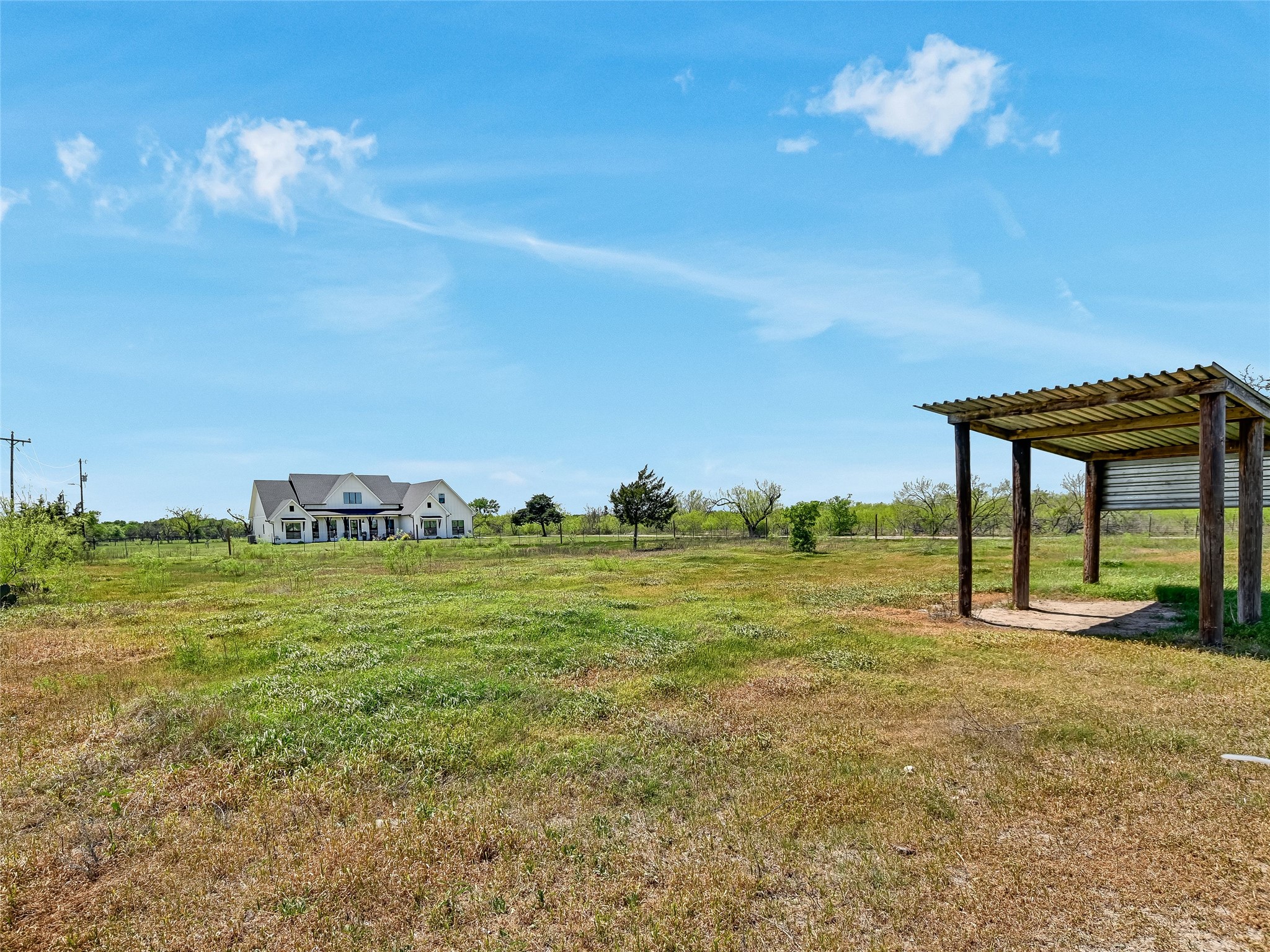19819 Lockwood Road Manor, TX 78653 - Photo 26 of 29 From this vantage point, the scale of the property comes to life, offering a rare chance to create your own outdoor haven—whether that’s gardens, grazing, or gatherings.