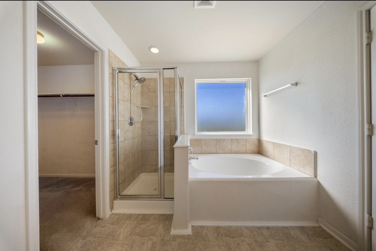 15003 Signal Ridge Way Cypress, TX 77429 - Photo 14 of 21 a spacious bathroom with a tub shower and sink