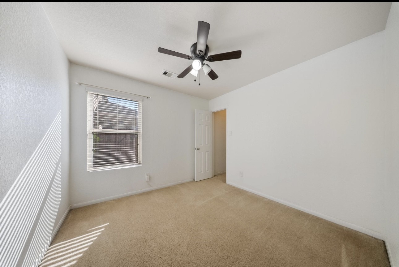 15003 Signal Ridge Way Cypress, TX 77429 - Photo 18 of 21 a view of an empty room with a window