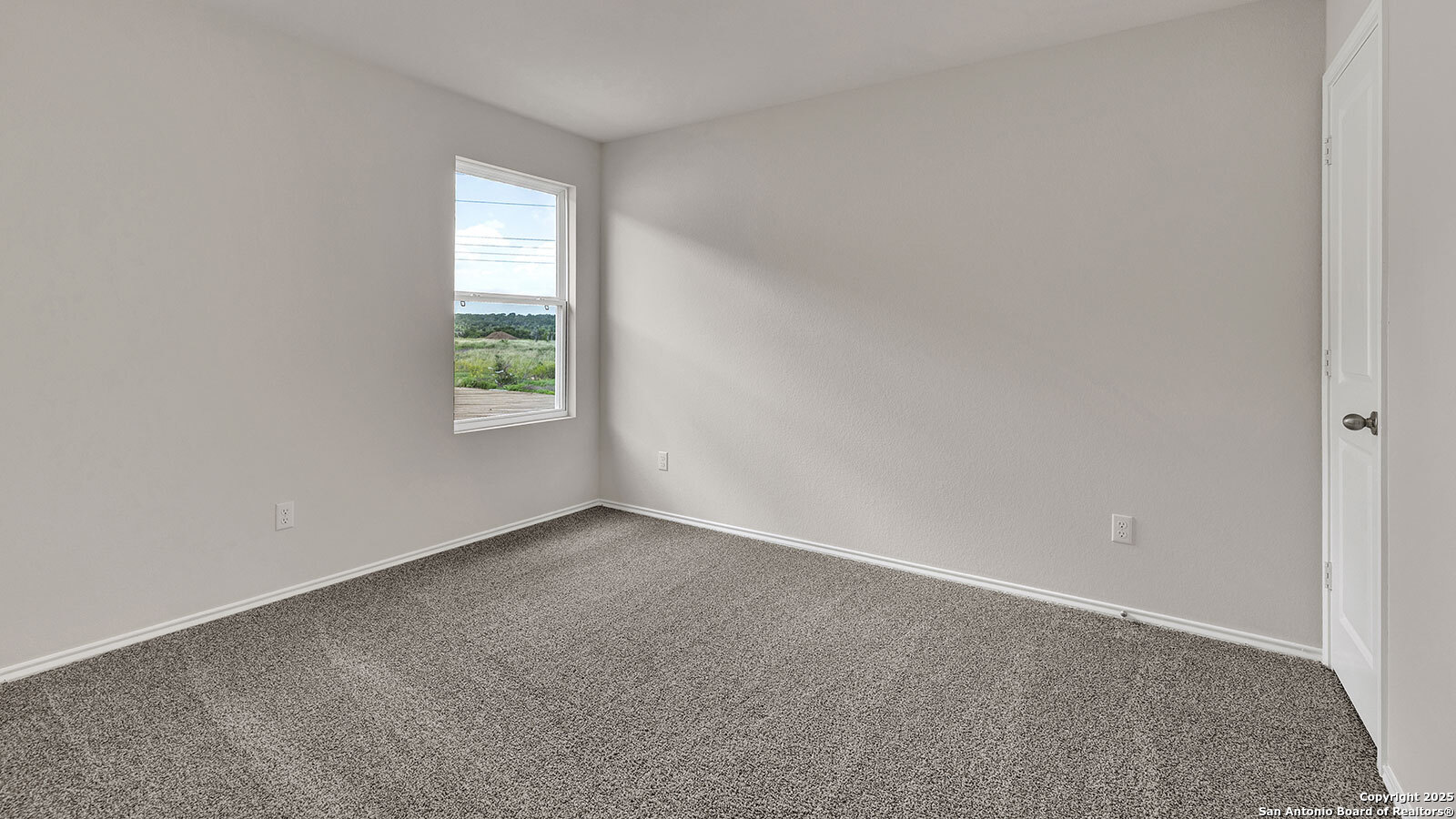 322 Hodges Street Maxwell, TX 78656 - Photo 10 of 34 an empty room with windows