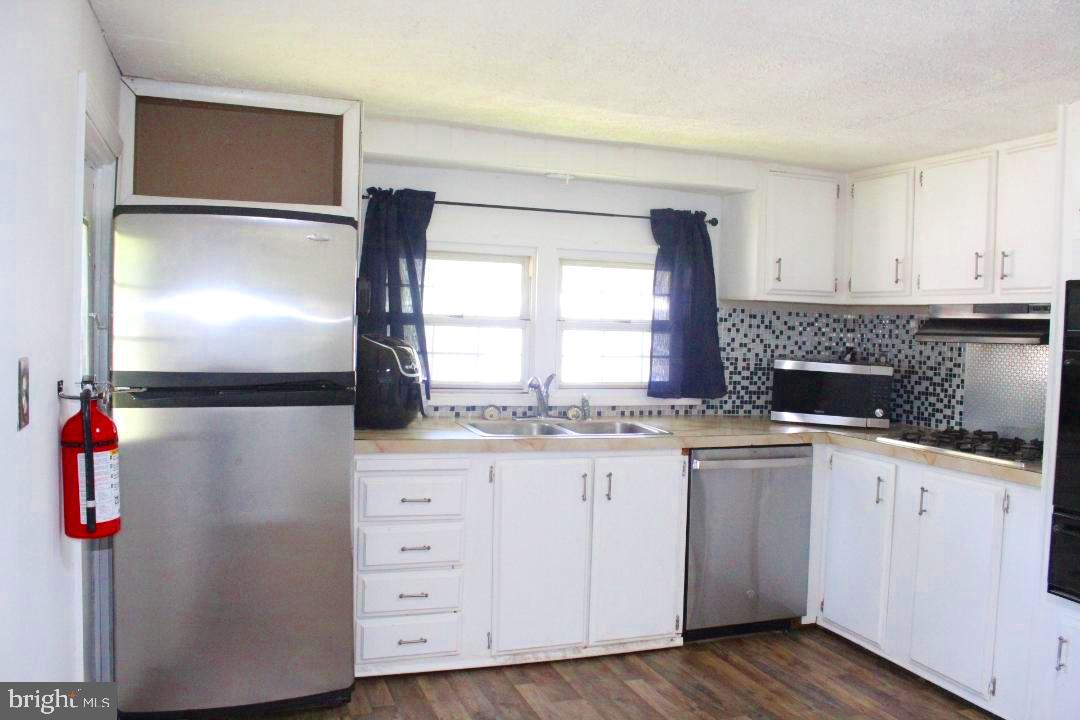 1762 Crown Point Road, Unit 2310B West Deptford, NJ 08086 - Photo 2 of 39 a kitchen with granite countertop cabinets stainless steel appliances and a sink