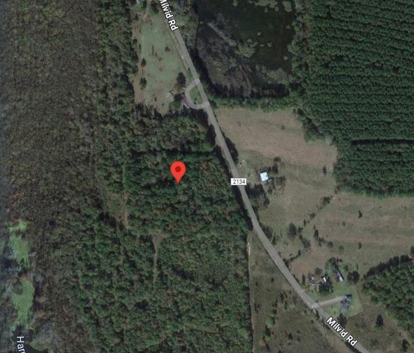 2715 County Road 2134 Cleveland, TX 77327 - Photo 2 of 8 a aerial view of a house with a yard