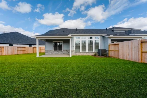 a view of a house with backyard porch and garden