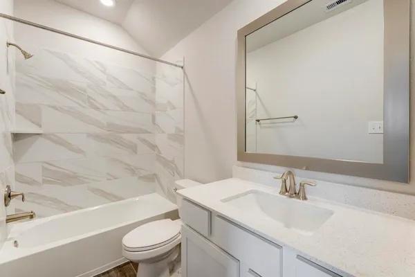 a bathroom with a sink a toilet and a bathtub