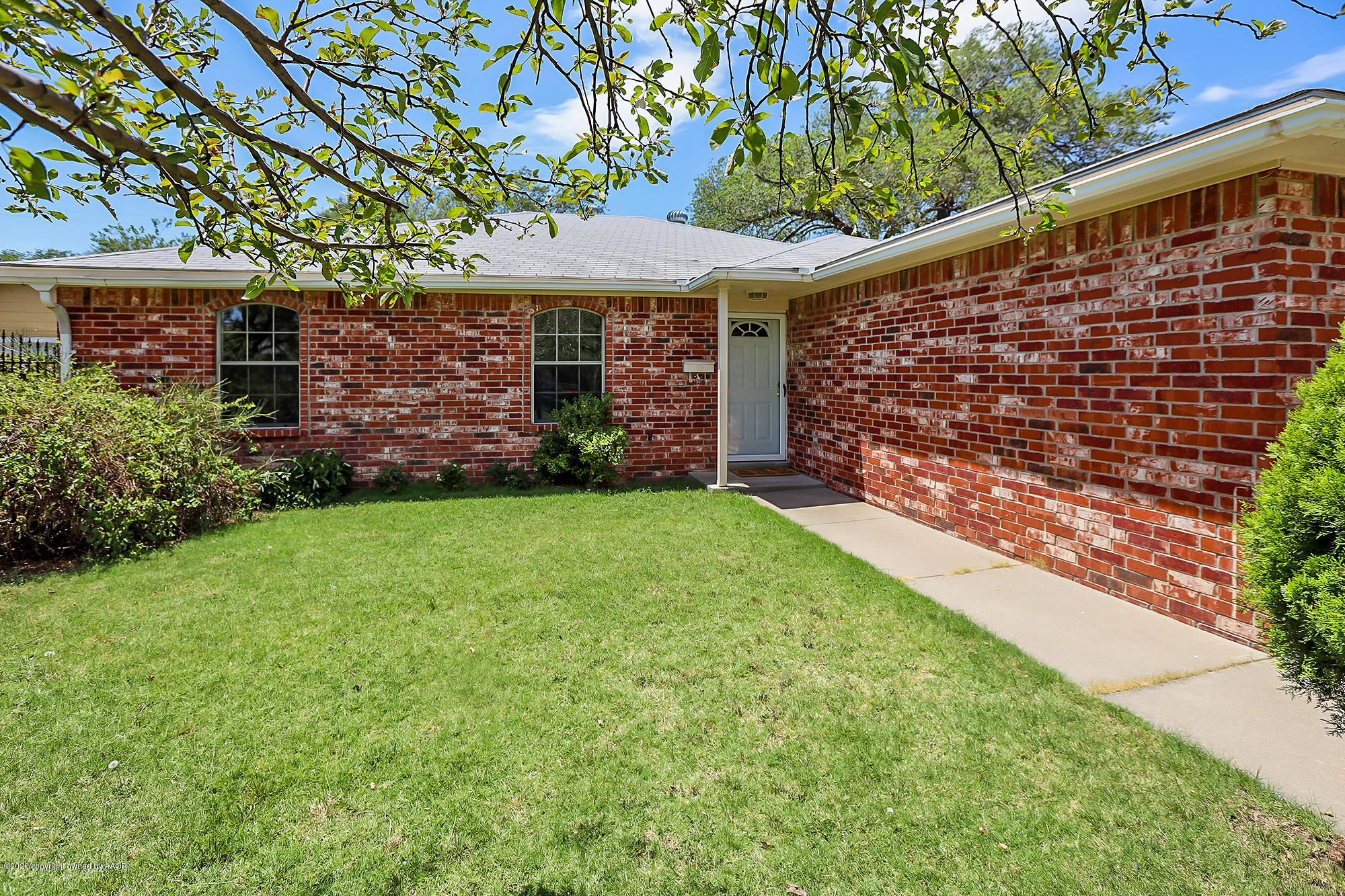 4110 South Hayden Street Amarillo, TX 79110 - Photo 1 of 28 a front view of a house with garden