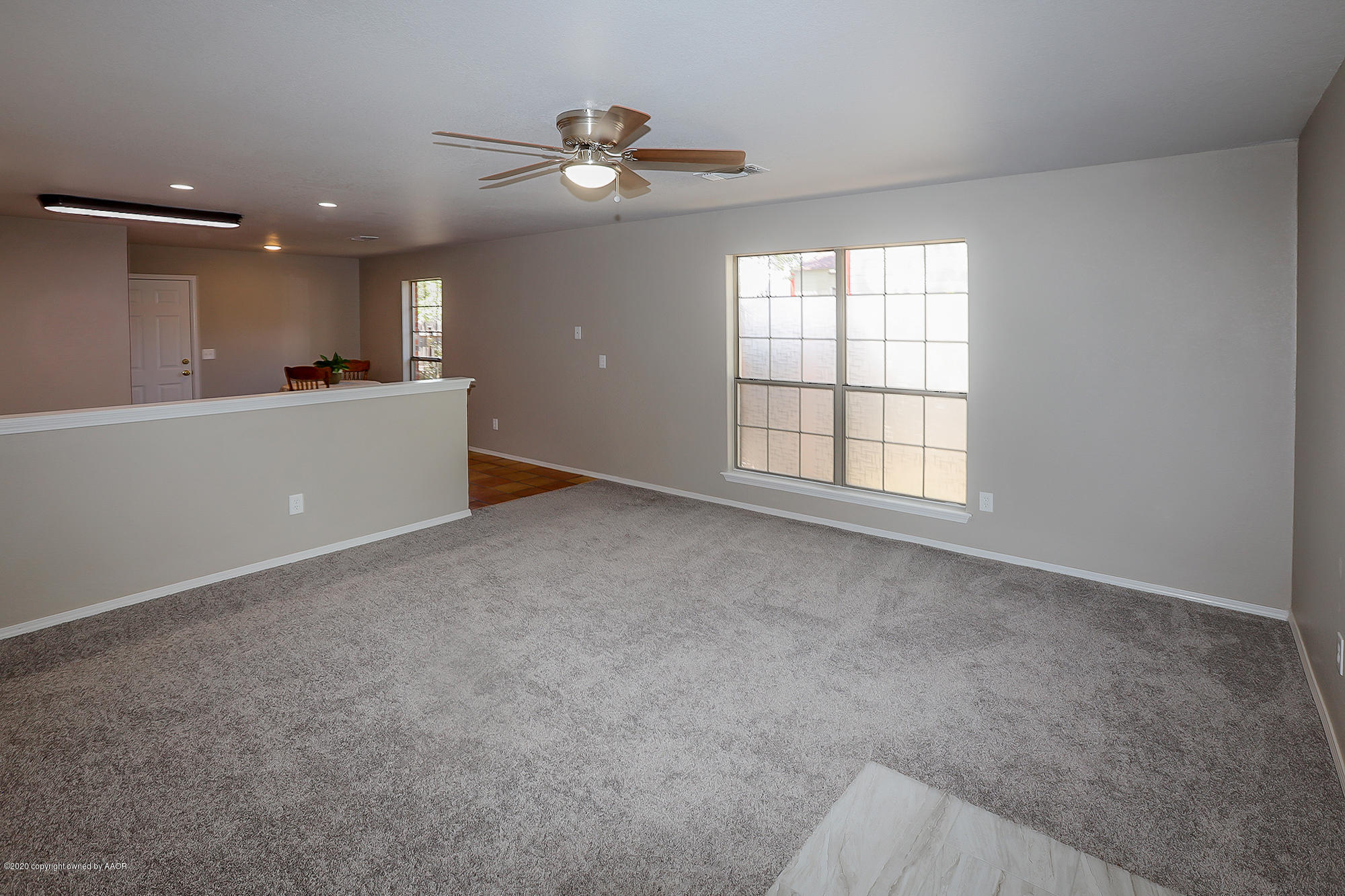 4110 South Hayden Street Amarillo, TX 79110 - Photo 4 of 28 a view of an empty room with a window