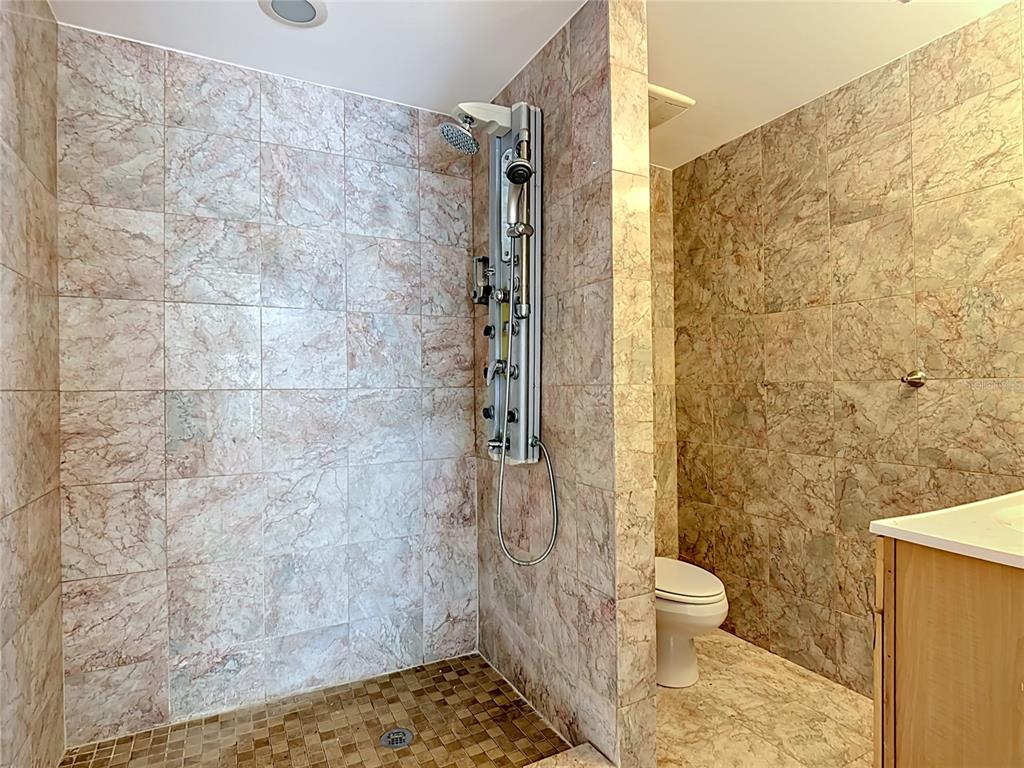 7925 Lake Mabel Loop Road Lake Wales, FL 33898 - Photo 60 of 97 a bathroom with a toilet and a shower