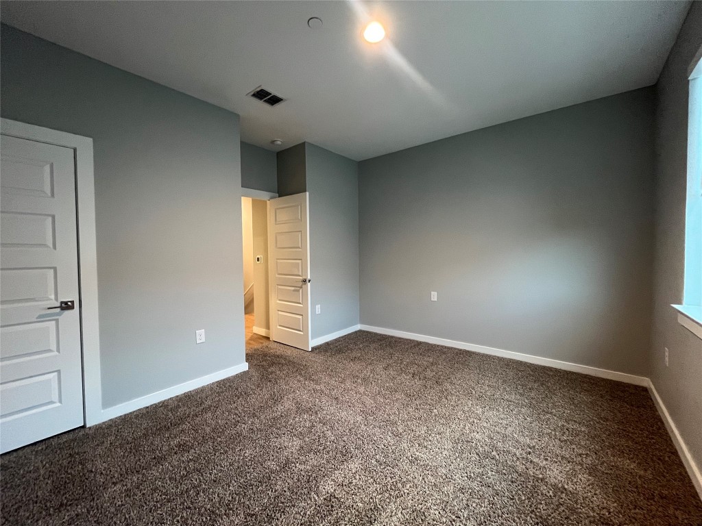 11402 Pastini Circle Manchaca, TX 78652 - Photo 14 of 21 an empty room with windows and closet