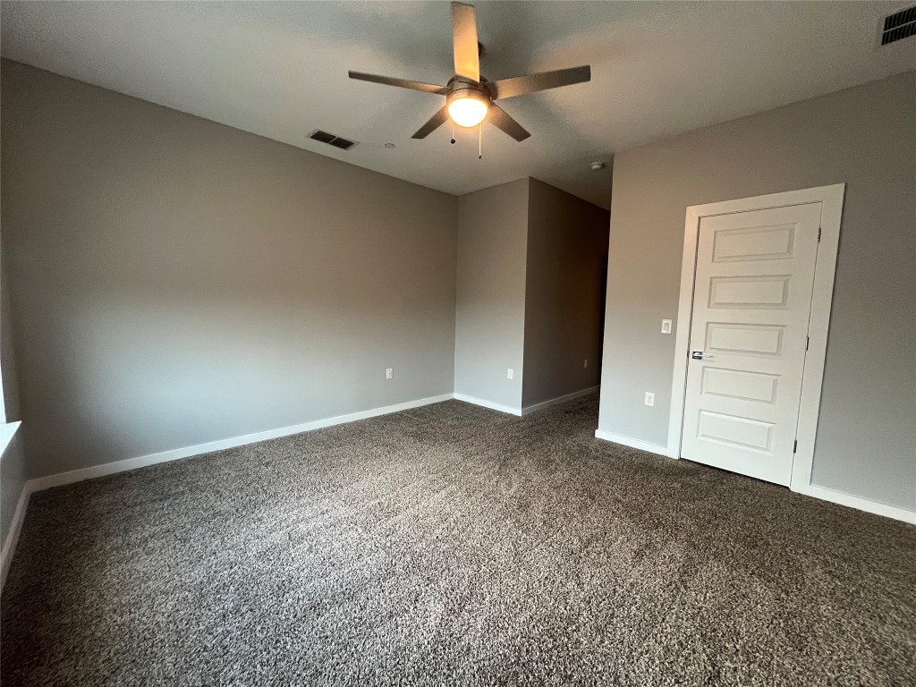 11402 Pastini Circle Manchaca, TX 78652 - Photo 20 of 21 a view of a livingroom with a ceiling fan and window