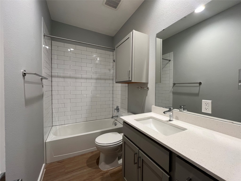 11402 Pastini Circle Manchaca, TX 78652 - Photo 3 of 21 a bathroom with a sink a toilet and shower