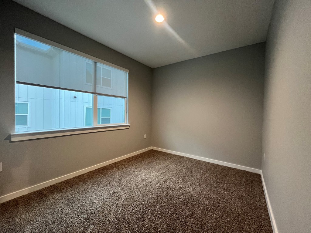 11402 Pastini Circle Manchaca, TX 78652 - Photo 4 of 21 an empty room with windows