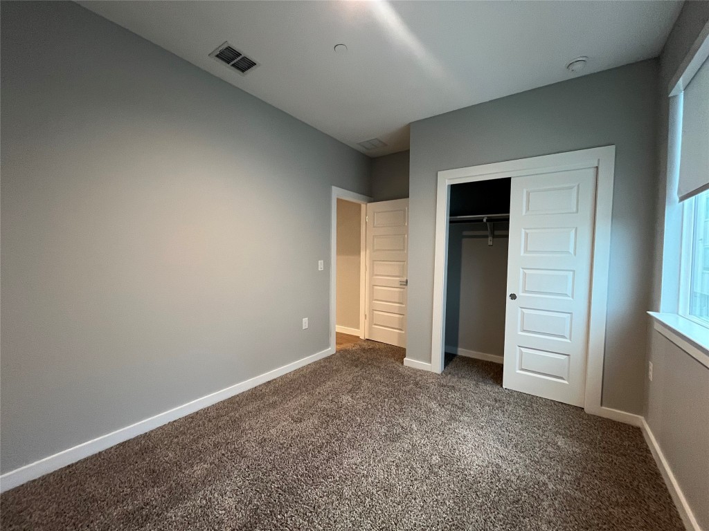 11402 Pastini Circle Manchaca, TX 78652 - Photo 5 of 21 an empty room with closet and natural light