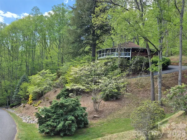 a backyard of a house with lots of green space