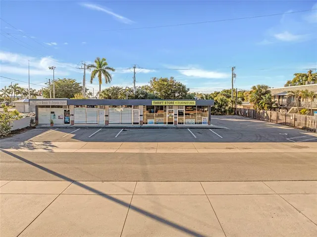 a view of a big building next to a road