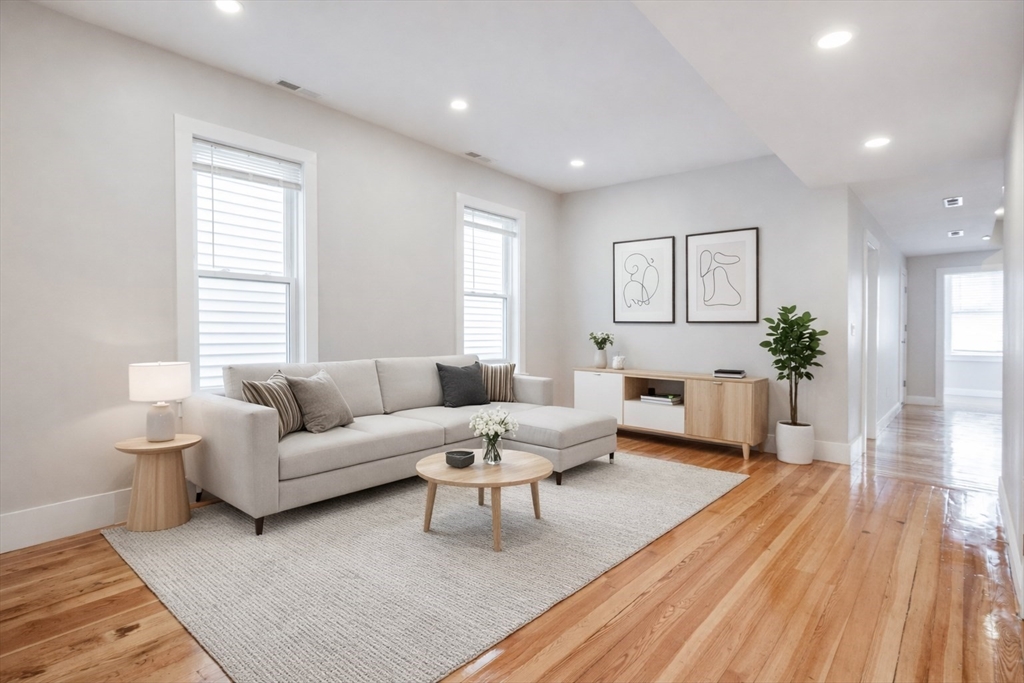 232 Saratoga Street, Unit 2 Boston, MA 02128 - Photo 1 of 9 a living room with furniture and a large window