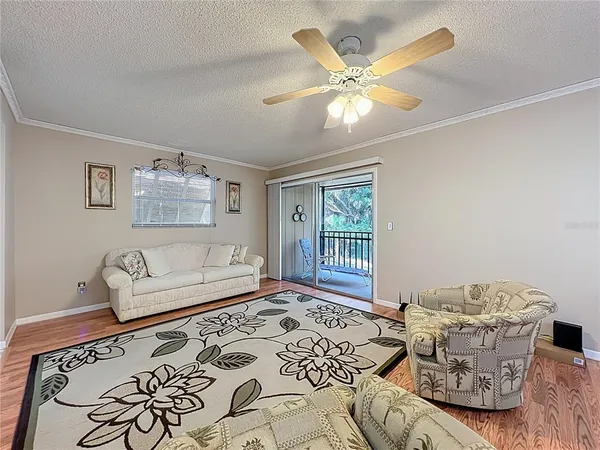 a open kitchen with a sink hardwood floor and a refrigerator