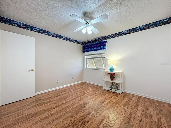 a view of a livingroom with furniture and windows