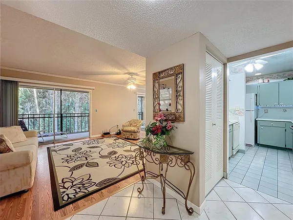 a bedroom with furniture and a rug