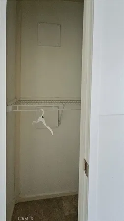 a view of small space with racks on the wall